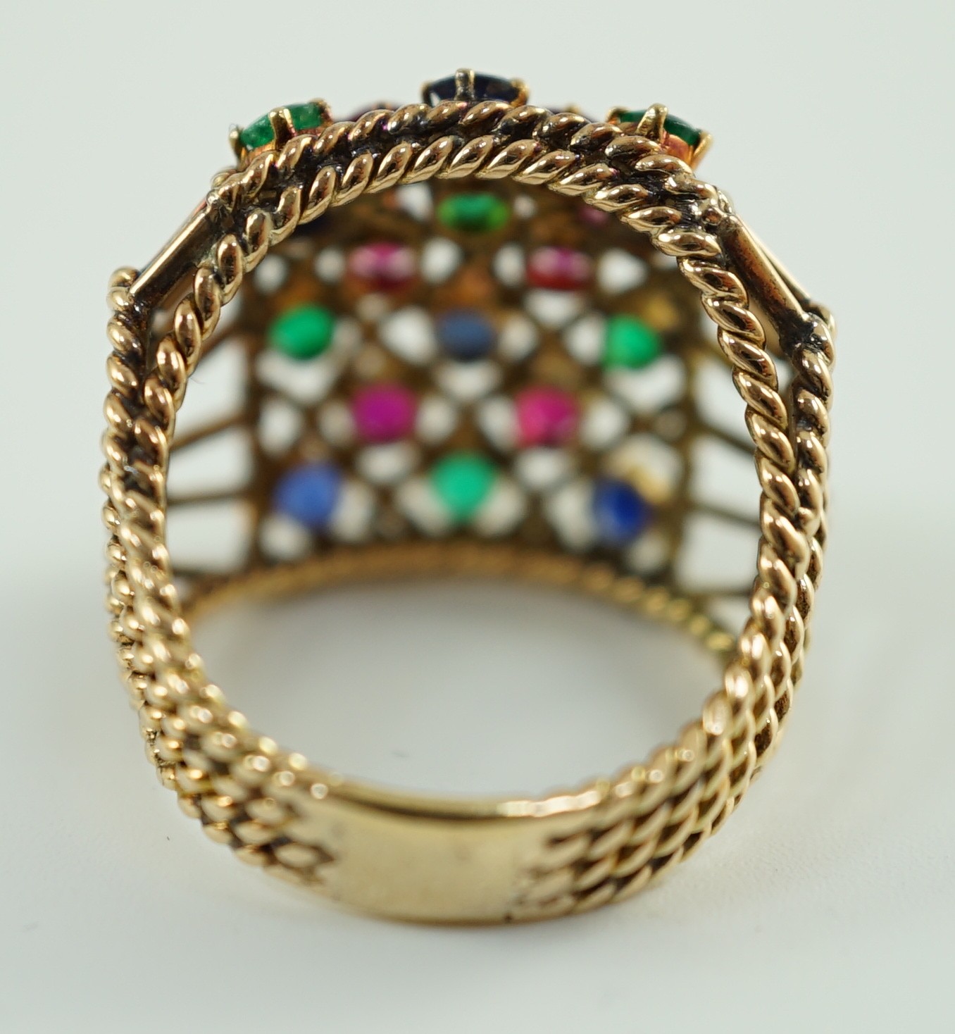 An Indian gold, ruby, sapphire and emerald cluster set dress ring
